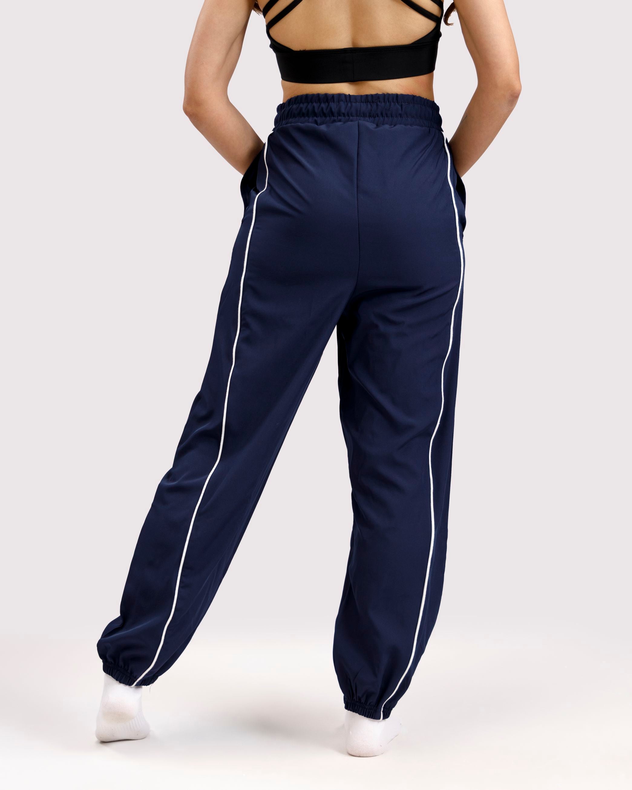 Women lightweight woven training pants back view navy Pakistan