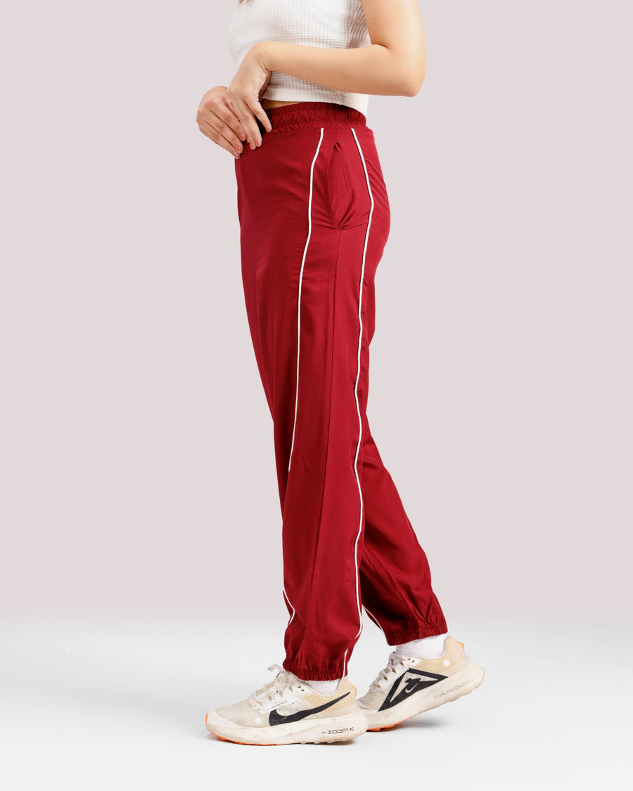 Women lightweight woven training pants side view red Pakistan