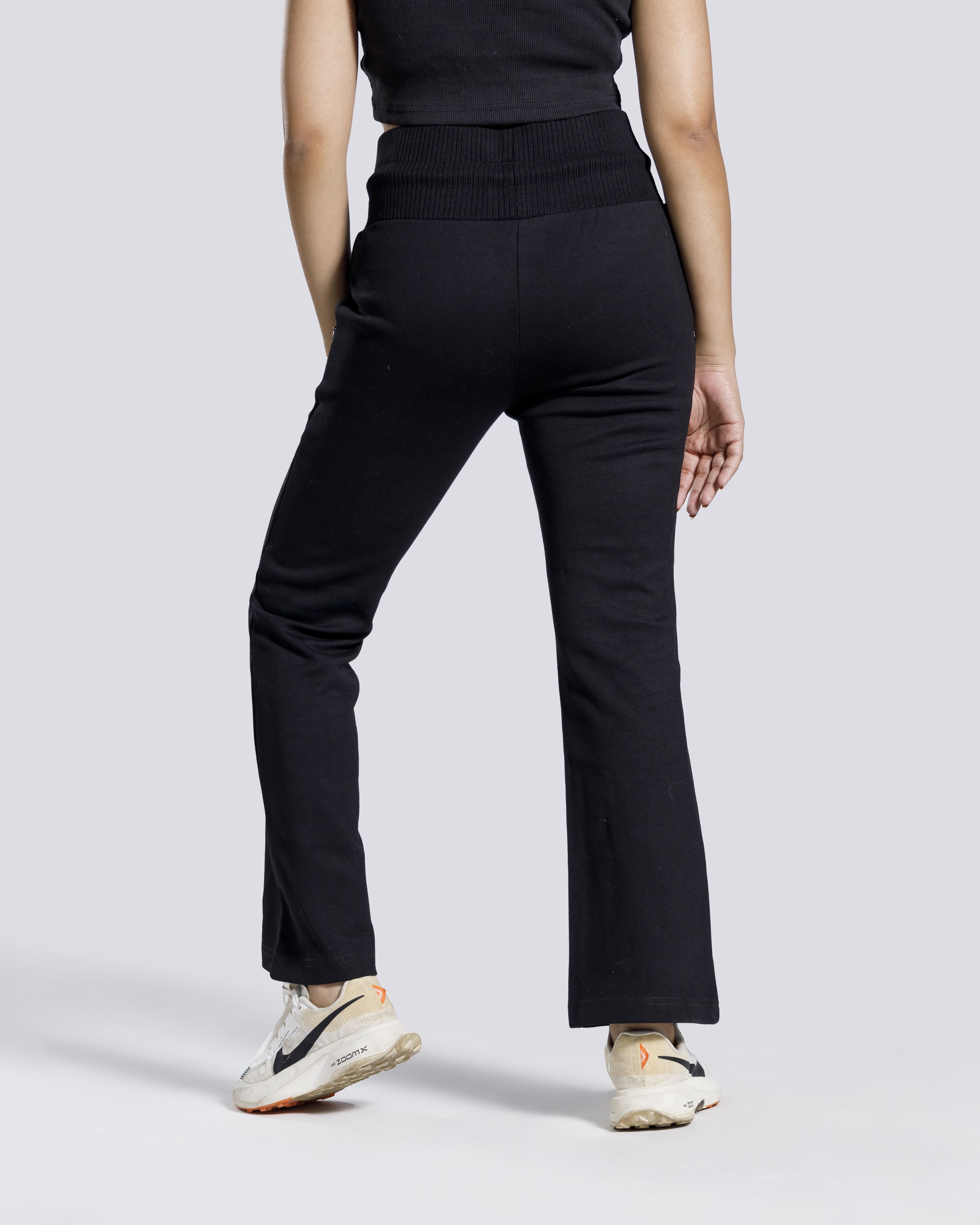 Women flared gym trousers side view black Pakistan